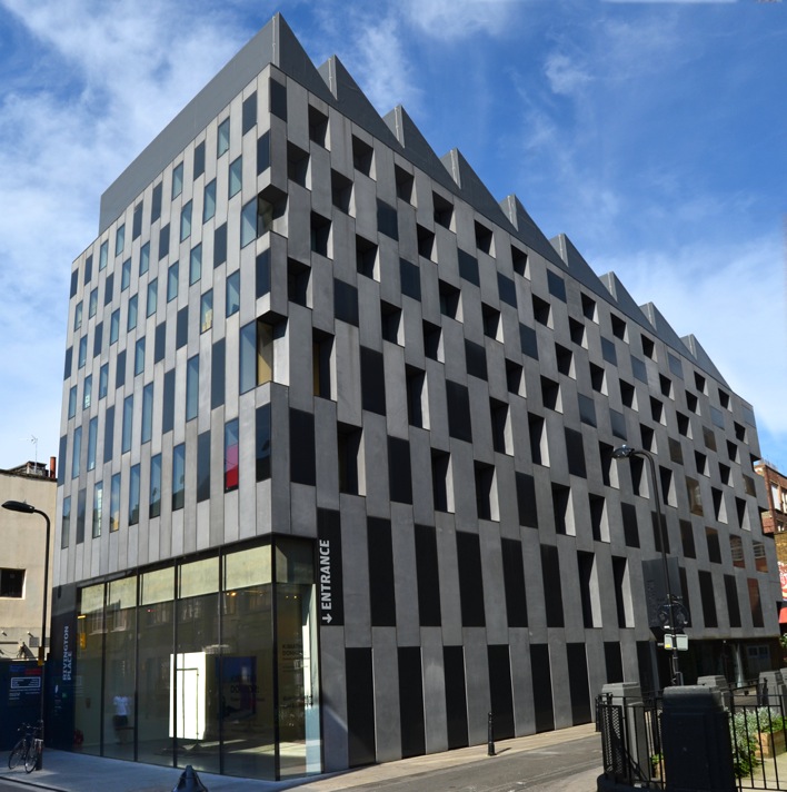 Modern building with a geometric black and white facade against a blue sky. | Patterncutter, CC BY-SA 3.0, via Wikimedia Commons
