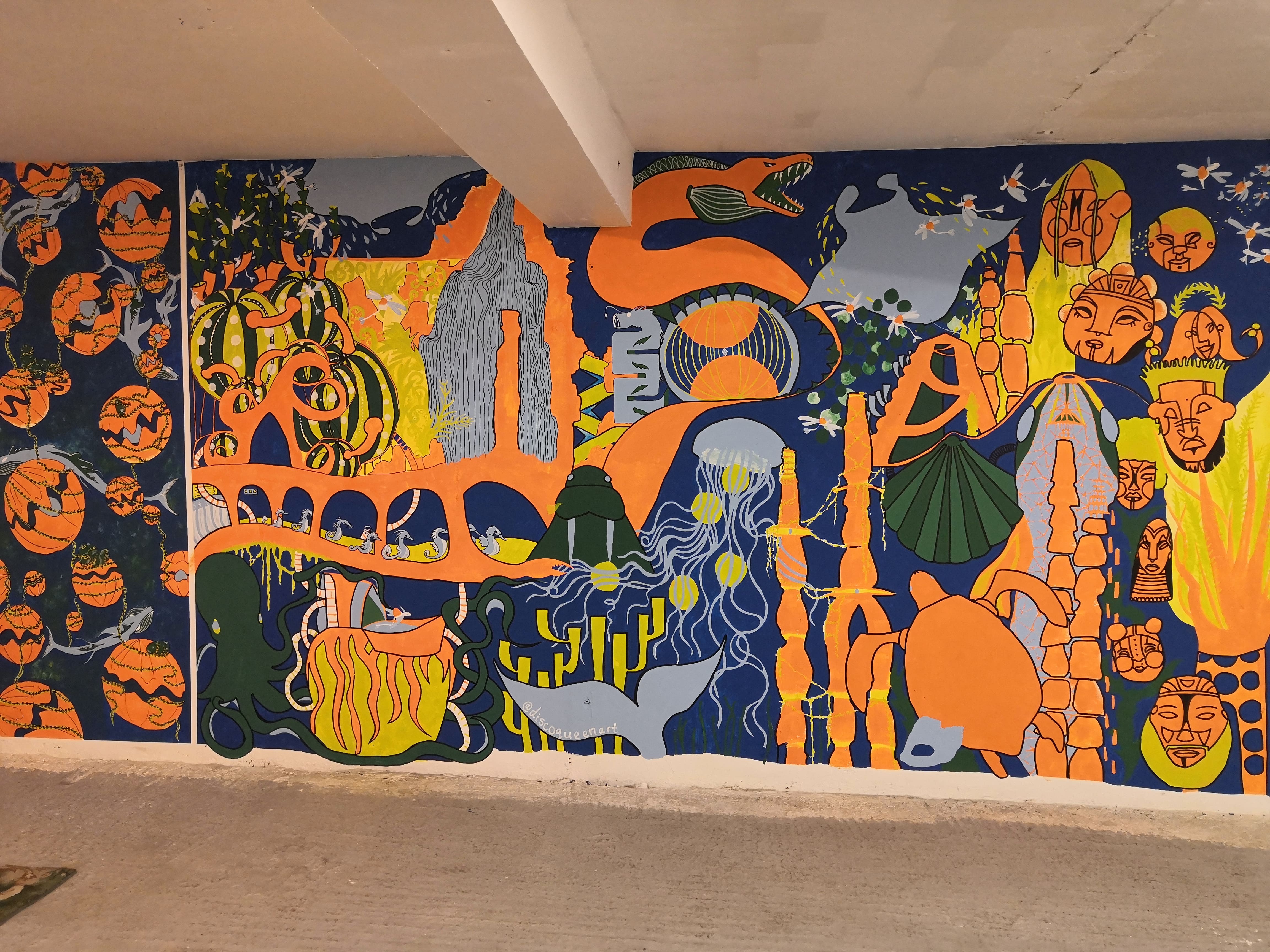 Brightly painted orange and blue mural called Atlantis City, with an underwater theme | Ilayda Bakare, Artist, Founder and app developer of Exhibits