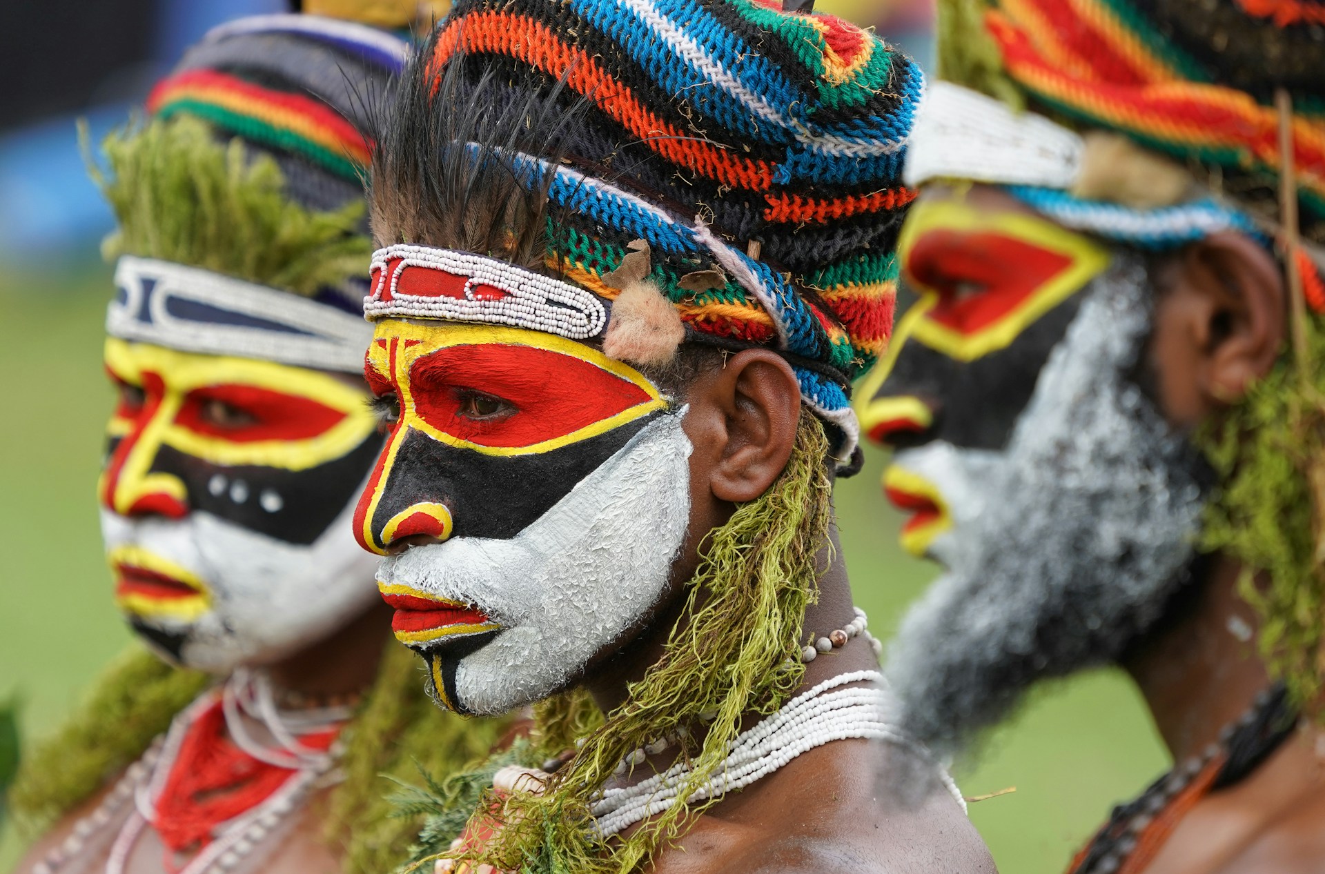 Colorful traditional headdress and beaded necklaces on an individual. | Photo by Bob Brewer on Unsplash