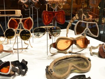 Collection of vintage eyewear displayed in a case.