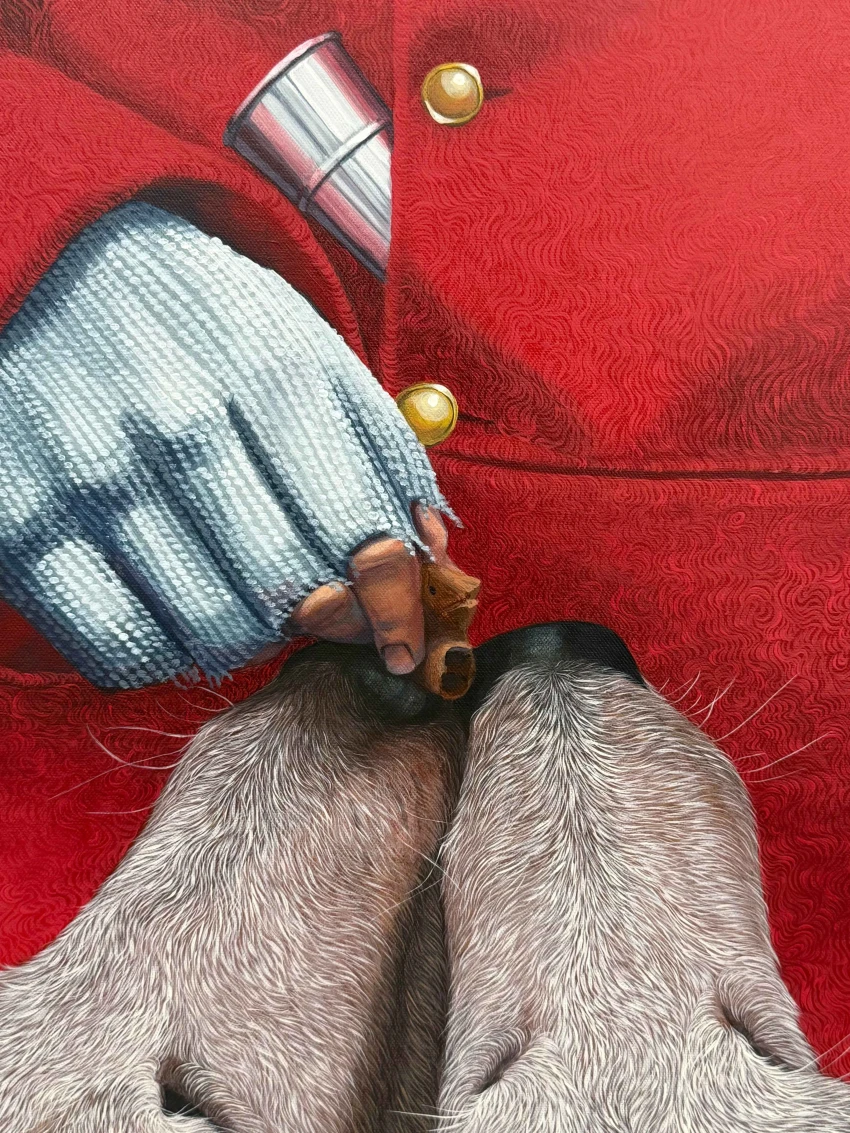 A close-up of a gloved hand offering a treat to two eager dog snouts, set against a vibrant red background.
