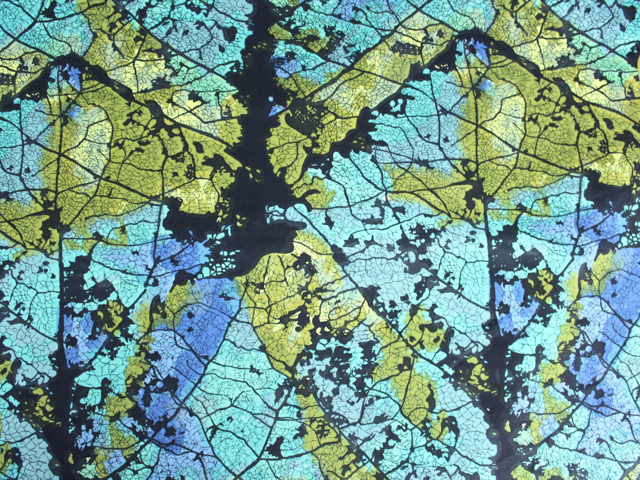 Abstract pattern of overlapping skeletonized leaves in shades of black, blue, green, and yellow.