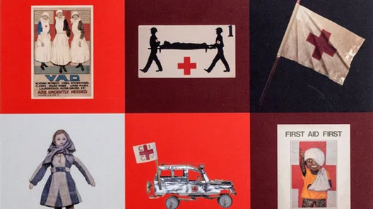 A collage featuring vintage Red Cross posters, a toy ambulance, a flag, a doll, and first aid imagery on a red and black background.