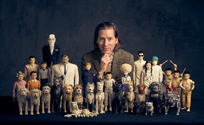A group of unique figurines, including stylized animals and characters, arranged in a dramatic setup against a dark background. | 2025 Design Museum