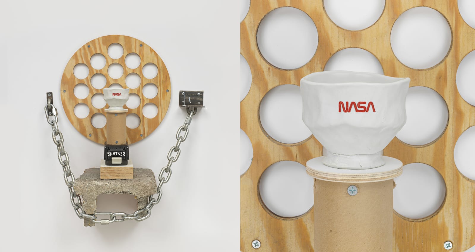 Artwork featuring a circular wooden structure with holes, a ceramic NASA bowl, and a chain attached to a concrete base.