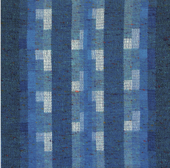 A close-up view of a blue and white rug featuring intricate patterns, highlighting its fabric texture and rectangular shape.