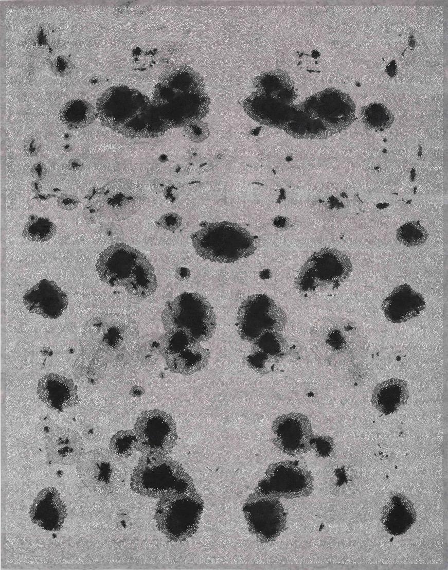 A close-up image showing a black spot in a drawing, with a focus on the texture and shading in black and white.