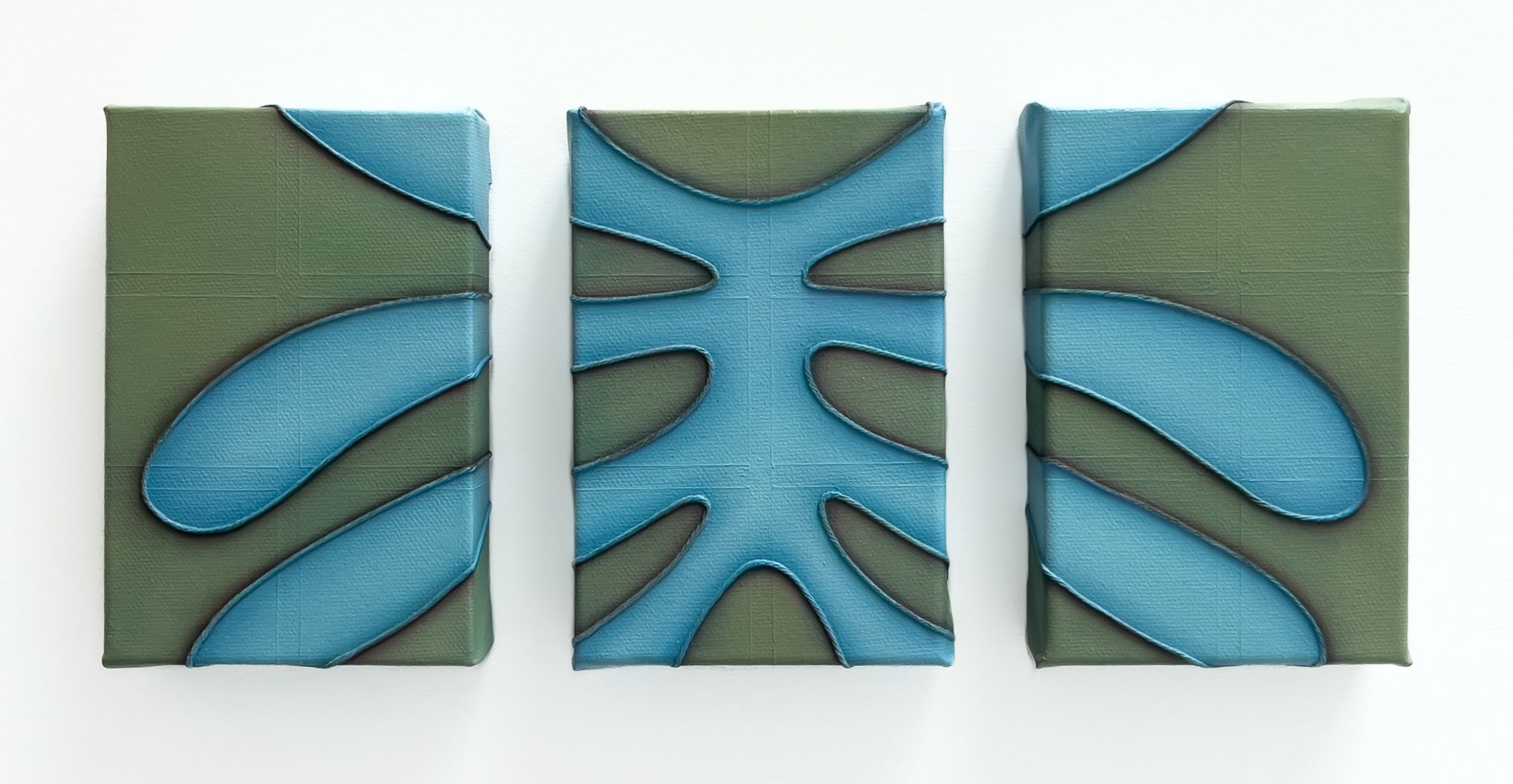 A collection of rectangular objects featuring a teal and turquoise pattern design.