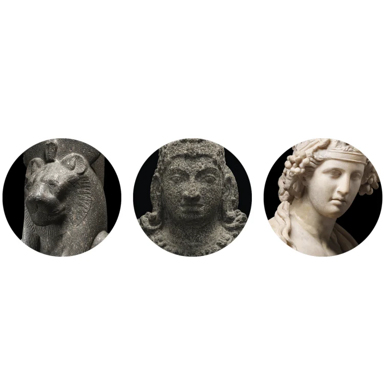 A group of statues arranged in circular formation, depicting human faces and resembling coins.