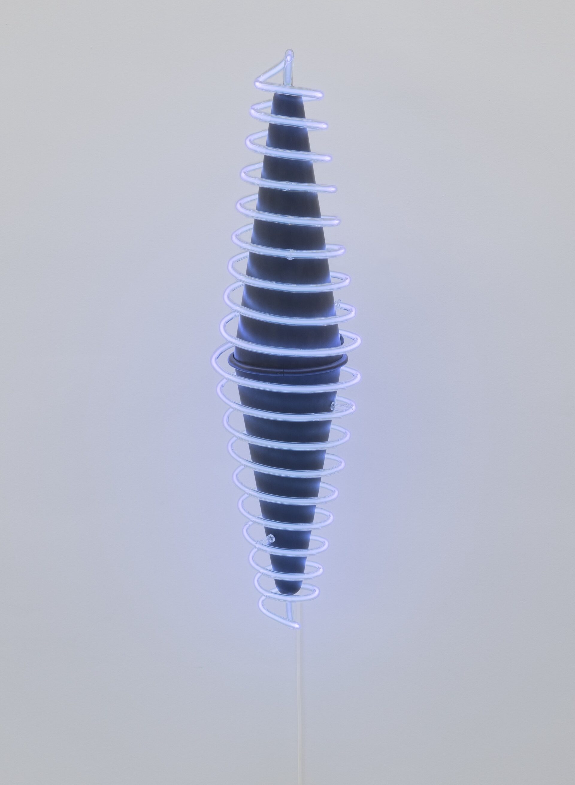 A blue cone with white spirals against a clear sky, surrounded by the atmosphere of an outdoor airshow.