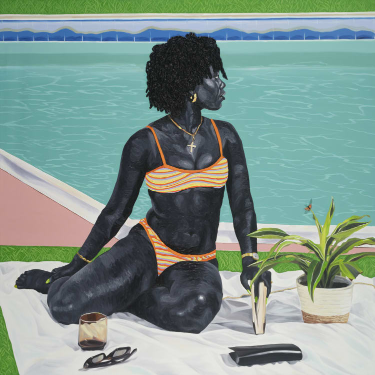 A person in an orange-striped bikini sits casually on a blanket by a swimming pool, with a potted plant and book nearby.