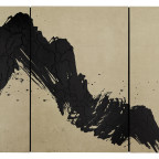 A single black brushstroke on a light tan background.