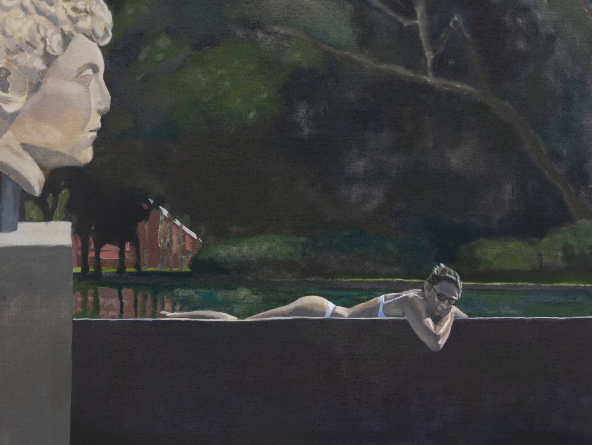 A woman relaxing on a poolside, surrounded by water and outdoor scenery.