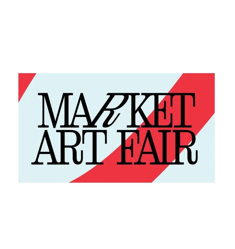 Market Art Fair logo with the text "MARKET ART FAIR" in bold, stylish font, set against a light blue background with diagonal red stripes.