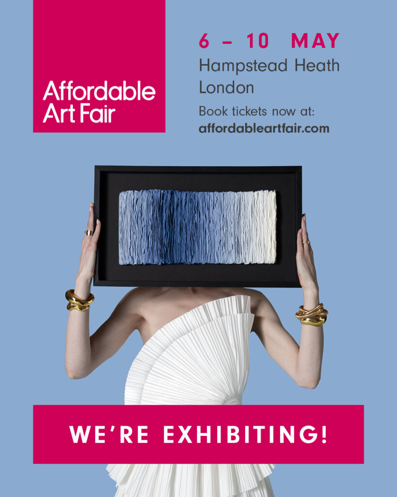 A woman holding a framed abstract artwork, promoting the Affordable Art Fair taking place from May 6 to 10 in Hampstead Heath, London.