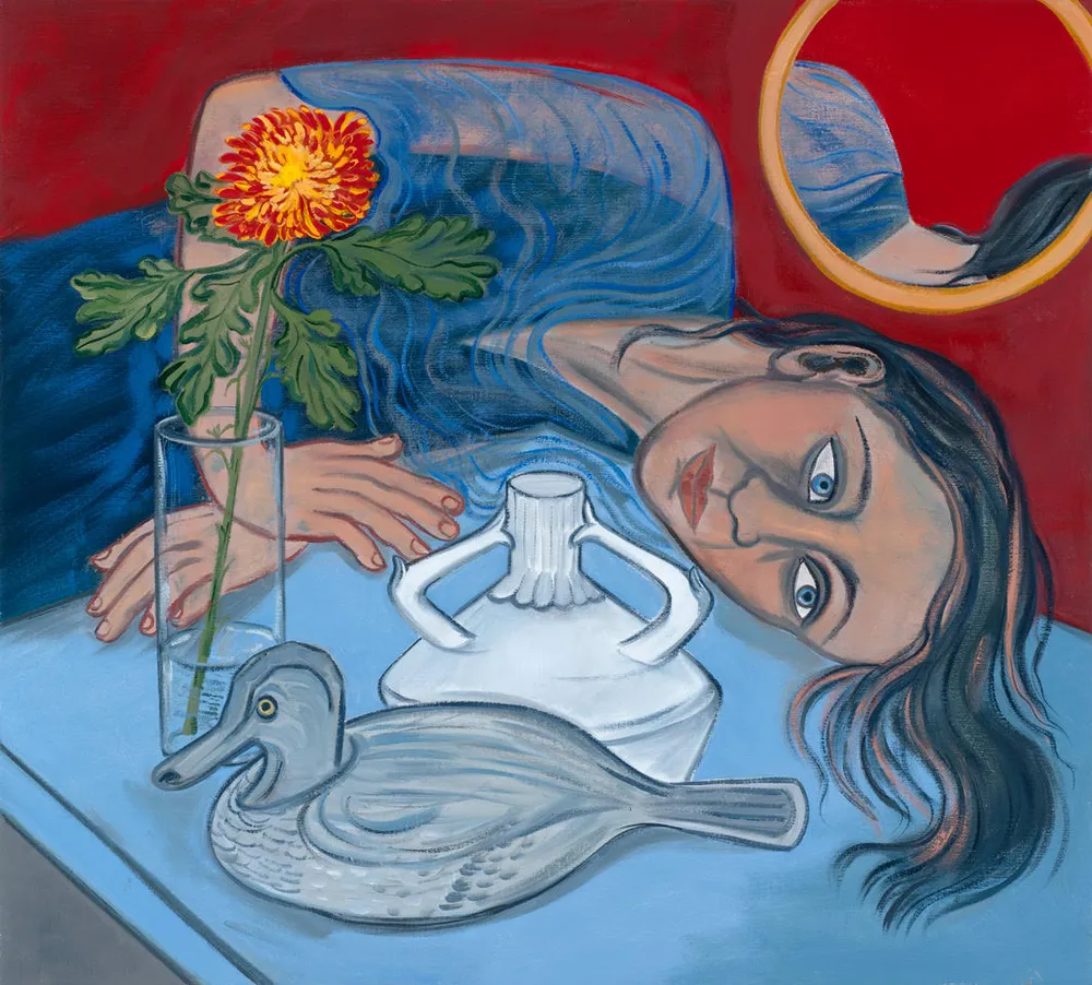 A woman with long dark hair lies on a table, her head tilted to the side. She gazes directly at the viewer, surrounded by a flower in a glass vase, a white vase-like object, and a gray duck figurine. A circular mirror reflects part of her hair against a red background.