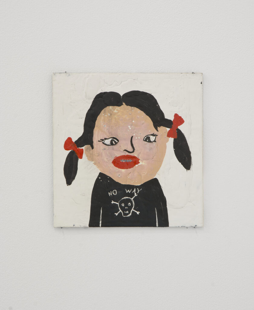 A painting of a girl with black hair in pigtails wearing a black shirt, red bows, and bright red lips. The shirt has a skull graphic on it, and the girl has an expression that suggests disbelief or surprise. The background is white. | 2026 Mother's Tankstation