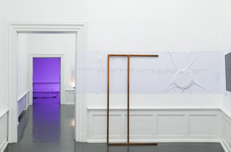 A minimalist art gallery interior with a white wall featuring an orange horizontal bar and a purple lit area visible through an open doorway.
