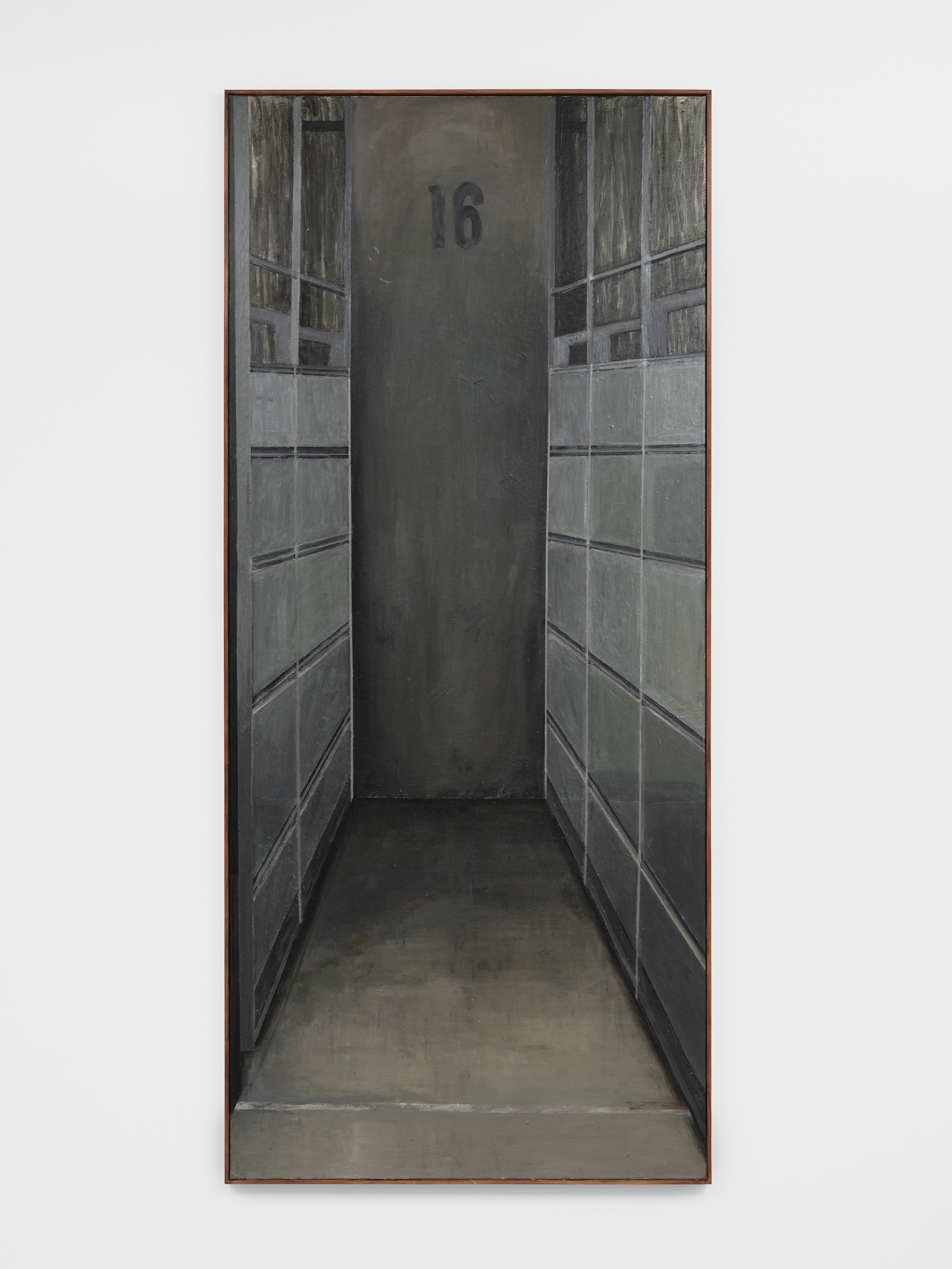 A dimly lit, narrow hallway with gray walls and lockers on either side, featuring the number "16" on the wall at the end.