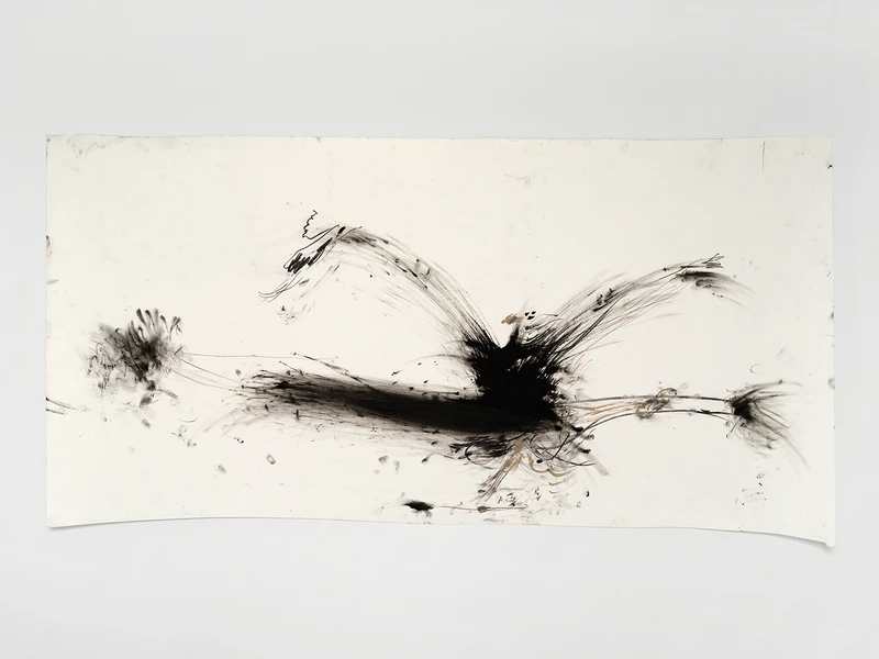 An abstract artwork featuring bold black brush strokes on a white canvas, creating dynamic, expressive marks that suggest movement and energy.