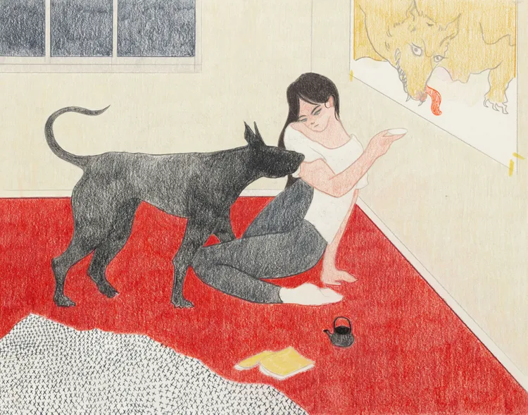 A woman sitting on a red carpet in a room, interacting with a black dog while pointing at a drawing on the wall that features a cow. A book and a teapot are on the floor nearby.